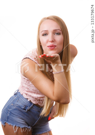 Woman sending air kiss Woman sending air kiss 133179674