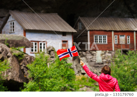 Tourist visiting Helleren houses in Jossingfjord, Norway 133179760