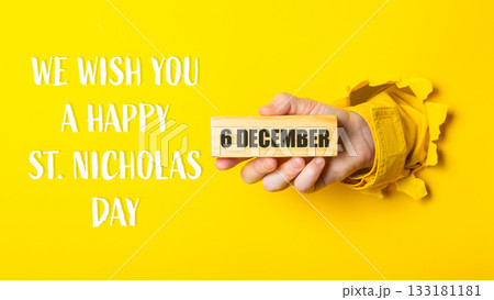 We wish you a happy 6th St. Nicholas Day written on a yellow background We wish you a happy 6th St. Nicholas Day written on a yellow background 133181181