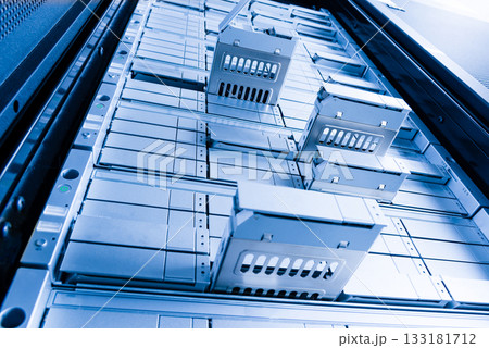 detail of data center with some of hard drive bays open 133181712