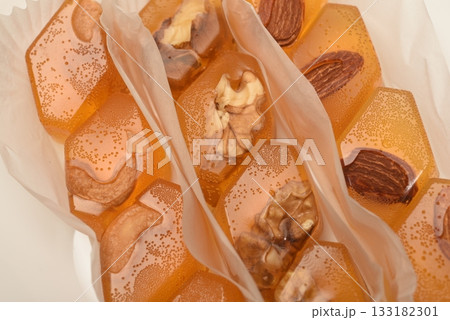 Orange marmalade with nuts. A sweet snack. 133182301
