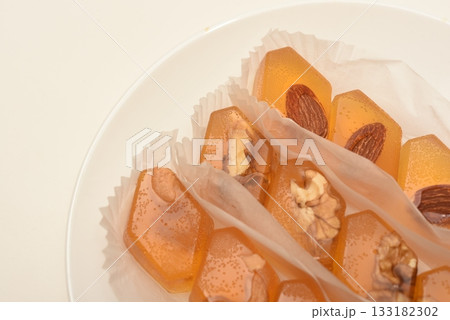 Orange marmalade with nuts. A sweet snack. Orange marmalade with nuts. A sweet snack. 133182302