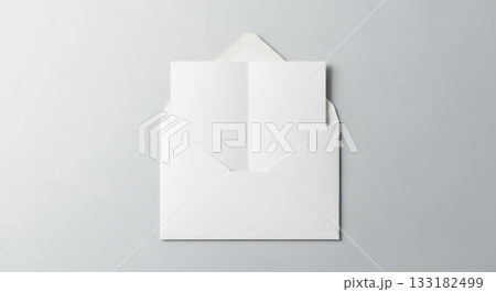 Blank invitation card in white envelope on subtle gray background 133182499