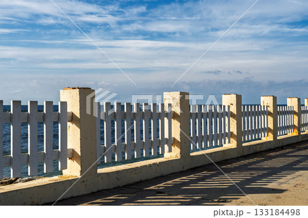 An old embankment along the seashore, a sky with wisps of cloud, a natural concept awaiting the winter storm season 133184498