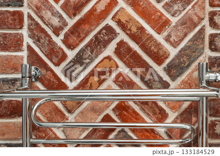 Bathroom design with a heating device on a wall decorated with natural brick, old style in the design of spaces in the loft style Bathroom design with a heating device on a wall decorated with natural brick, old style in the design of spaces in the loft style 133184529