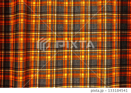 Background with checkered curtain on the window, curtains for protection from the sun on a hot afternoon, the idea of using natural materials in interior design 133184541