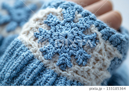 Rustic Charm. Trending in fashion. Crochet details of snowflakes pattern on a modern garment. Winter atmosphere in clothes. Rustic Charm. Trending in fashion. Crochet details of snowflakes pattern on a modern garment. Winter atmosphere in clothes. 133185364