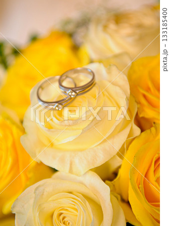 Elegant precious Diamond wedding Rings Resting On Surface With Blurred Backdrop For Wedding ceremony Elegant precious Diamond wedding Rings Resting On Surface With Blurred Backdrop For Wedding ceremony 133185400