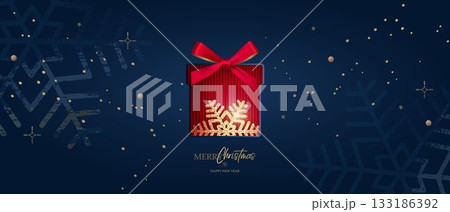 A festive banner with the inscriptions Merry Christmas and Happy New Year and snowflakes made with ink brushstrokes. A festive product display box 133186392