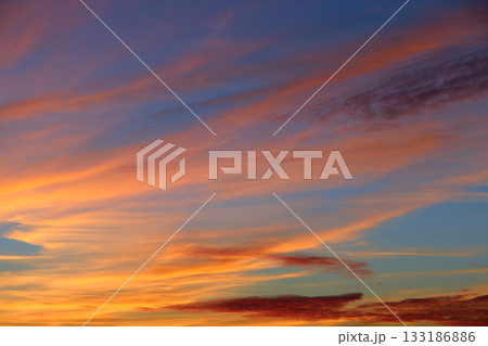 Orange sunset before night. Twilight with bright sunset. Evening landscape 133186886