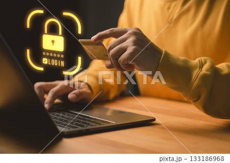 Person using a laptop computer and credit card with security shield, representing online payment protection, cybersecurity, shopping online, digital identity safety and secure transaction. Person using a laptop computer and credit card with security shield, representing online payment protection, cybersecurity, shopping online, digital identity safety and secure transaction. 133186968