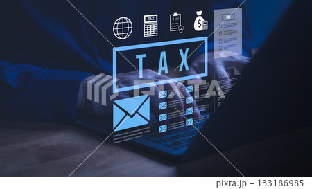 Person working on laptop computer with glowing tax icons, representing online tax filing, financial management, digital accounting, income reports, and modern business tax preparation solutions. 133186985