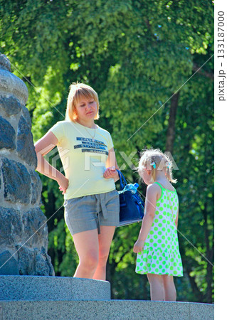 Mom scolding daughter for naughty behavior outside Mom scolding daughter for naughty behavior outside 133187000