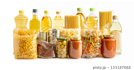 Foodstuff for donation, storage and delivery. Various food, pasta, cooking oil and canned food in cardboard box. Foodstuff for donation, storage and delivery. Various food, pasta, cooking oil and canned food in cardboard box. 133187088