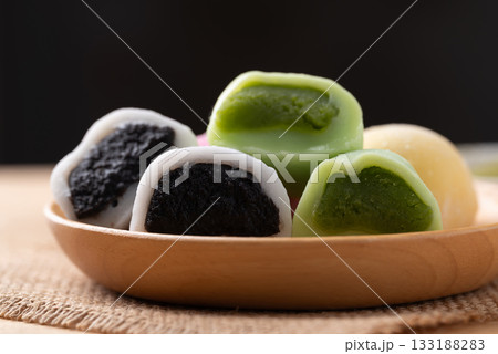 Daifuku mochi (Traditional Japanese sweet) stuffed with black sesame seed and matcha green tea Daifuku mochi (Traditional Japanese sweet) stuffed with black sesame seed and matcha green tea 133188283