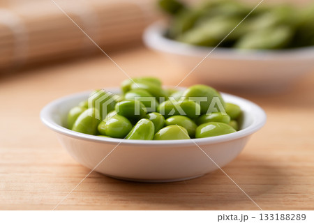 Boiled Edamame beans (Japanese soybeans) in a bowl on wooden background 133188289