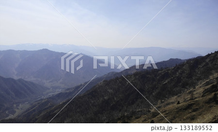 Majestic mountain range panorama under a clear blue sky. Media 133189552