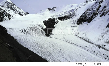Majestic glacier melting in the vast mountain range. Media Majestic glacier melting in the vast mountain range. Media 133189680