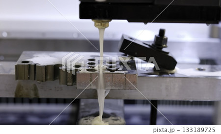 Electrical discharge machining cutting metal piece with sparks. Media Electrical discharge machining cutting metal piece with sparks. Media 133189725