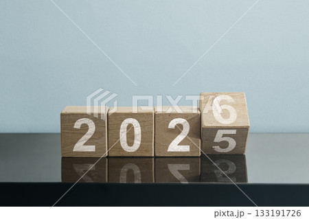 New Year Transition Wooden Blocks Changing from 2025 to 2026, symbolizing new beginnings, business and holiday concept, happy new year, new year background, celebration concept. 133191726