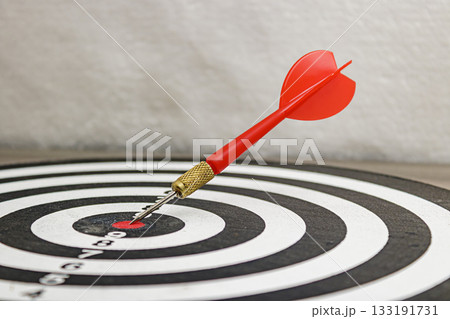 Bullseye Hit Perfect Aim on a Dartboard, target accuracy concept, perfect accuracy. 133191731