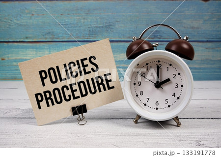Policies Procedure text written on paper card with alarm clock on wooden background 133191778