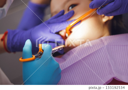 Child Undergoing Dental Check-Up at Dentist Office Getting Anesthesia Close-up 133192534