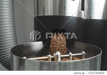Roasted Coffee Beans Pouring Into Cooling Bin at Roastery Roasted Coffee Beans Pouring Into Cooling Bin at Roastery 133192600