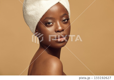 Portrait of Afro ethnicity smiling girl with natural make-up. 133192627