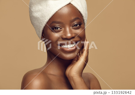 Black woman enjoying result of beauty skin care procedures. 133192642
