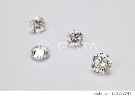 Four white diamonds are arranged in a row on a white background Four white diamonds are arranged in a row on a white background 133192747