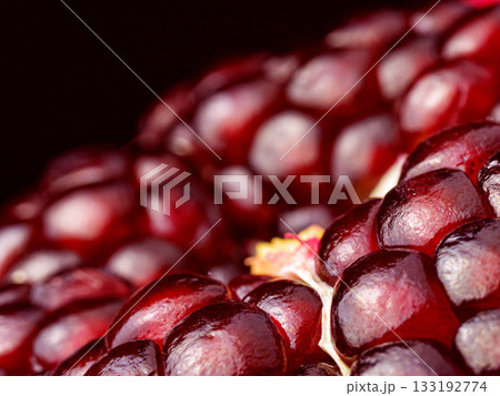 A close up of a red pomegranate fruit with a lot of detail 133192774