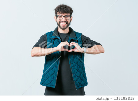 Funny man making heart shape isolated. Handsome guy making heart shape with hands Funny man making heart shape isolated. Handsome guy making heart shape with hands 133192818