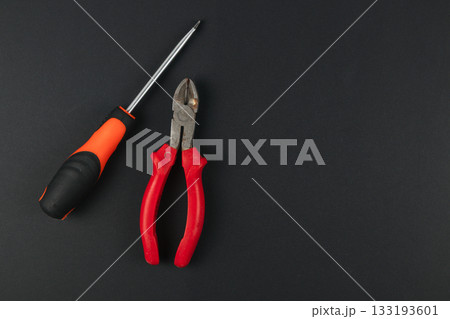 Tools arranged on a black surface for a DIY project Tools arranged on a black surface for a DIY project 133193601