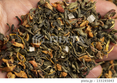 hold green tea with the addition of natural flavors and pieces of fruits and berries, green tea with the addition of taste and smell of other sweet foods 133193843