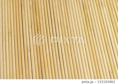 Thin round bamboo sticks are used as supports for indoor or other agricultural plants or for cooking, thin long sticks made of bamboo have a wide range of applications from cooking 133193862