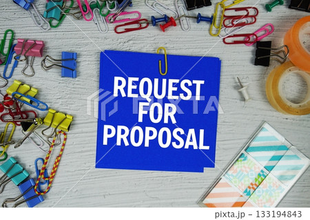 Request For Proposal text on stick note with stationery on concrete background 133194843