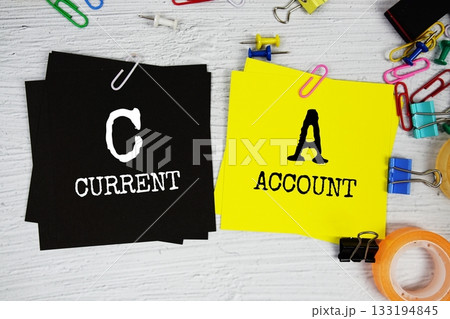 CA - Current Account text on stick note with stationery on concrete background CA - Current Account text on stick note with stationery on concrete background 133194845