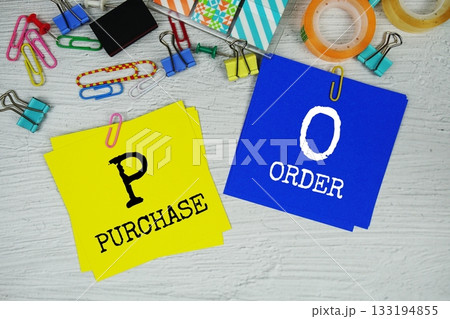 PO - Purchase Order text on stick note with stationery on concrete background 133194855