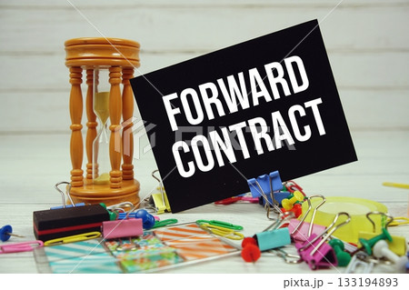 Forward Contract text on paper card with stationary on wooden background 133194893