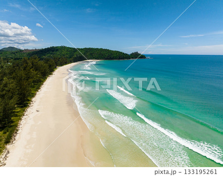 Aerial drone of sandy beach and turquoise water in the tropics. Kalampunian beach. Sabah, Borneo, Malaysia. Aerial drone of sandy beach and turquoise water in the tropics. Kalampunian beach. Sabah, Borneo, Malaysia. 133195261