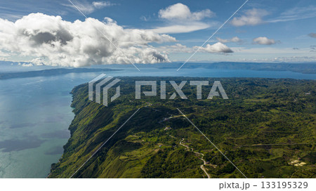 Top view of lake Toba and Samosir Island among the mountains in the early morning. Sumatra, Indonesia. 133195329
