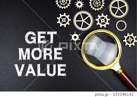 Get More Value text message with magnifying glass on black background 133196142