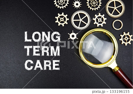Long Term Care text message with magnifying glass on black background Long Term Care text message with magnifying glass on black background 133196155