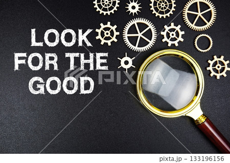Look For The Good text message with magnifying glass on black background 133196156