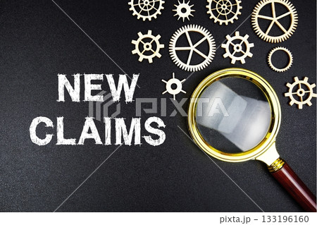 New Claims text message with magnifying glass on black background 133196160