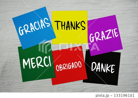 Thank You in different languages text on stick note on concrete background 133196181
