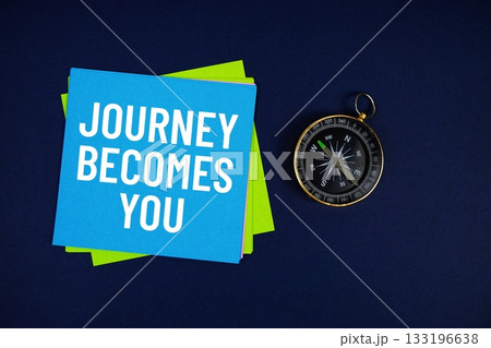 Journey Becomes You text written on sticky note with compass on blue background Journey Becomes You text written on sticky note with compass on blue background 133196638