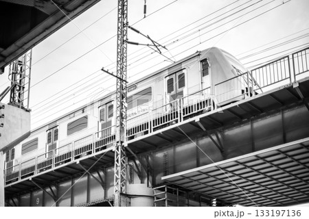 Black and white photo of a Korean rail train on an elevated track in Seoul, South Korea Black and white photo of a Korean rail train on an elevated track in Seoul, South Korea 133197136