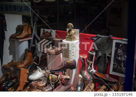 Shoe shop window display featuring various vintage leather shoes and boots in Seoul, South Korea Shoe shop window display featuring various vintage leather shoes and boots in Seoul, South Korea 133197146